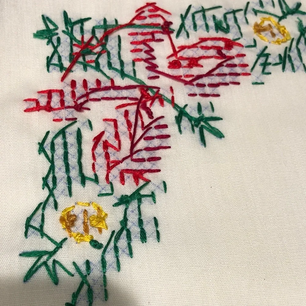 Embroidered Table Linens with Red Trim